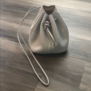 Small light blue leather bucket bag